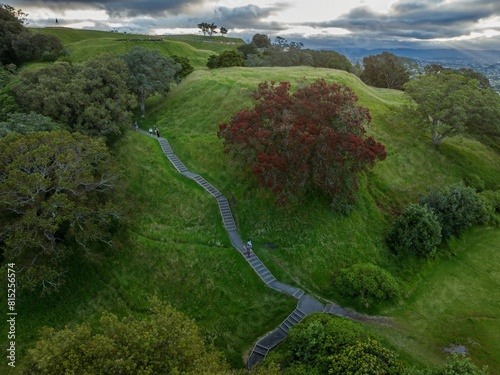 Walkway and flowering Pohutukawa tree on Mt Eden, Auckland, New Zealand. photo