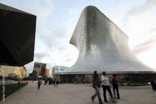 MEXICO CITY, MEXICO - NOVEMBER 17 . 2012: Visitors walk in  Plaza Carso in front of Soumaya Museum photo