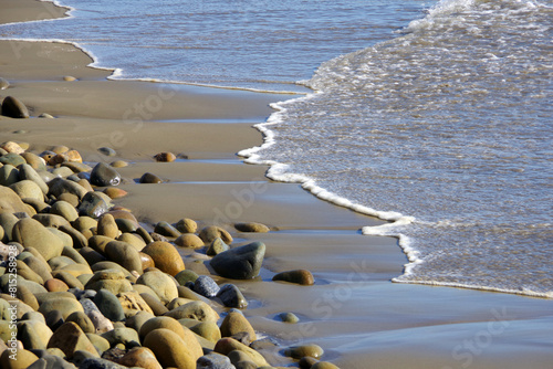Wet rocks on a California coast ocean beach