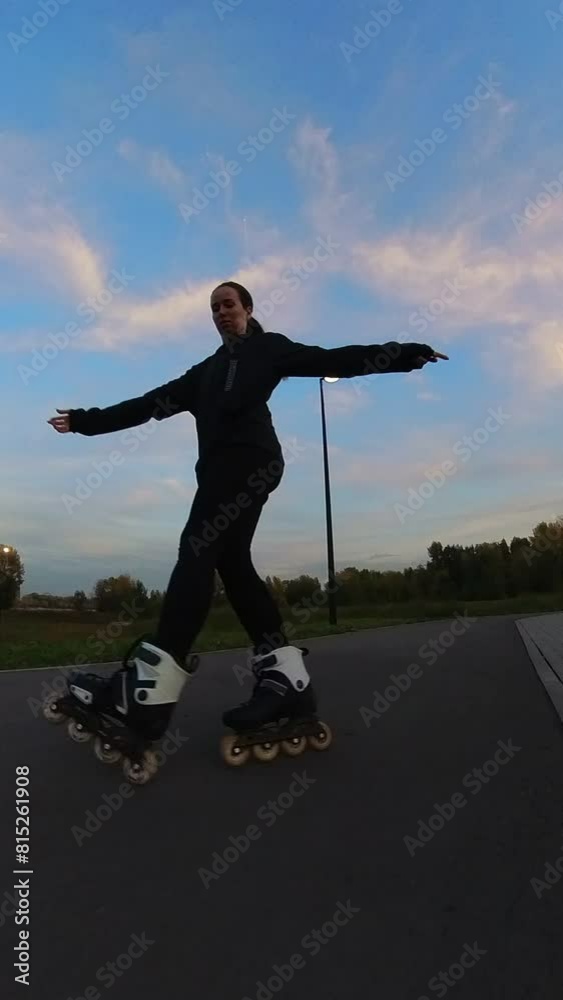 Caucasian woman roller skating in the evening. Slalom. Vertical video. Caucasian woman roller skating in the evening. Slalom. Vertical video.