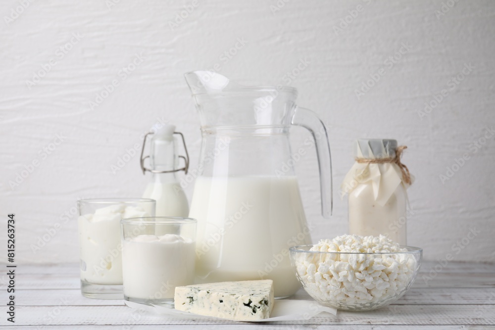 Different fresh dairy products on white wooden table Different fresh dairy products on white wooden table