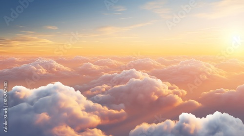 Majestic overhead view of fluffy clouds under the golden light of sunset, ideal for use in travel and lifestyle advertising.