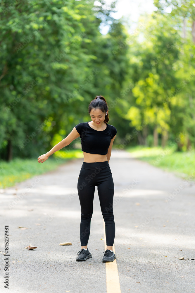Healthy young female runner stretches her legs before running in the park. Woman exercising for health, jogging outdoors, concept of people and lifestyle, health and well-being. In parks and outdoors Healthy young female runner stretches her legs before running in the park. Woman exercising for health, jogging outdoors, concept of people and lifestyle, health and well-being. In parks and outdoors