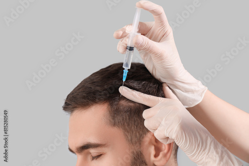 Young man receiving injecti...