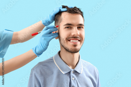 Doctor marking young brunet...