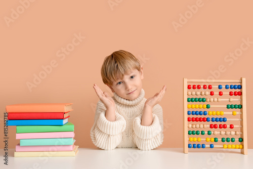 Cute little boy with books ...