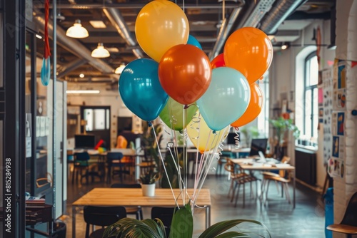 Multi-colored balloons on ribbons in the office to create a festive mood and congratulate colleagues on their birthday