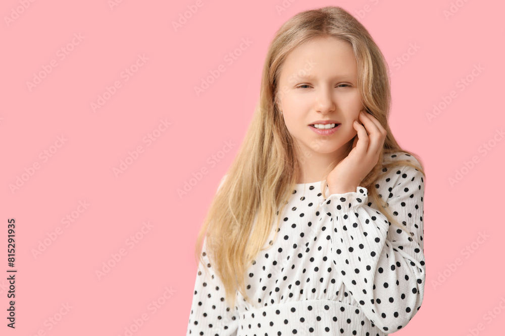 Young girl suffering from toothache on pink background Young girl suffering from toothache on pink background