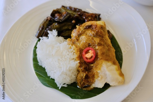 Photography Main dish of Portuguese-styled grilled fish with steamed rice, stir-fried eggpla