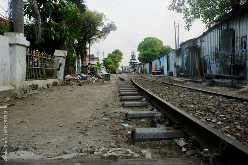 Urban Settlement by Abandoned Railway Tracks: A Glimpse into Life in a Run-Down Neighborhood photo