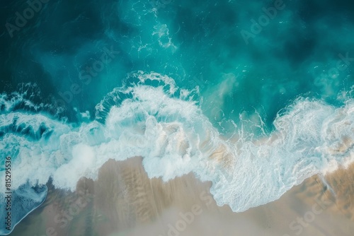 Blue and aquamarine sea waves and yellow sand with white foam. Sea beach background.