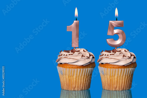 Birthday Cupcakes With Candles Lit Forming The Number 15.