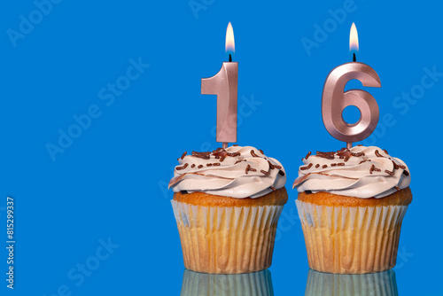 Birthday Cupcakes With Candles Lit Forming The Number 16.