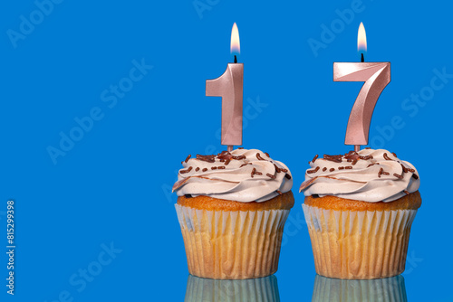 Birthday Cupcakes With Candles Lit Forming The Number 17.