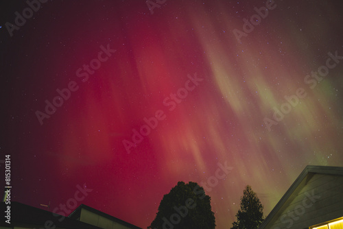 aurora australis or southern lights visible from Tasmania's clear night sky full of stars and constellations, shot in May 2024