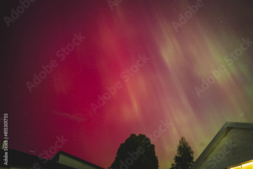 aurora australis or southern lights visible from Tasmania's clear night sky full of stars and constellations, shot in May 2024