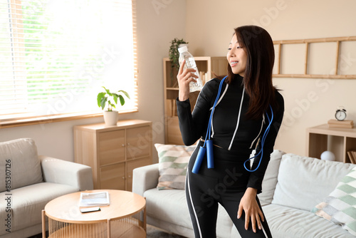 Sporty Asian woman with bot...