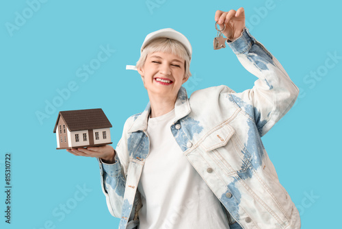 Happy young woman holding m...