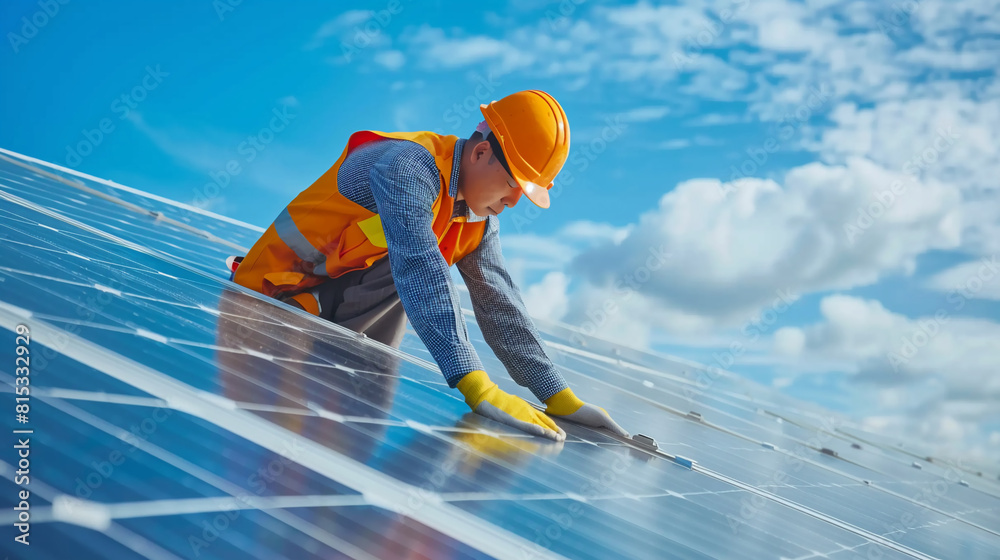 Green Factory Transition Engineer fitting solar panels to improve factory sustainability. Green Factory Transition Engineer fitting solar panels to improve factory sustainability.