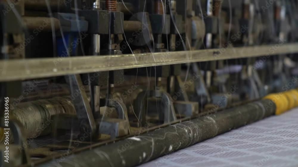 Spinning Machinery and Spindles in a Production Making a Mattress for a Bed, Close Up Shot in a Factory. Spinning Machinery and Spindles in a Production Making a Mattress for a Bed, Close Up Shot in a Factory.