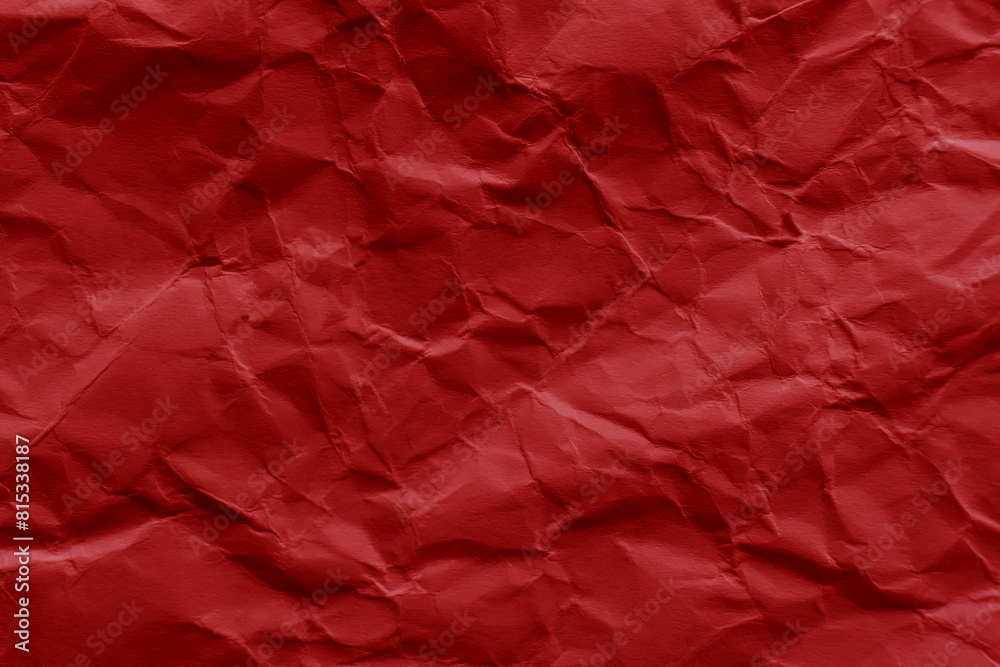Crumpled red paper texture background. Wrinkled paper surface. Crumpled red paper texture background. Wrinkled paper surface.
