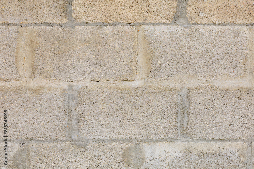 Fototapeta premium A wall made of gray bricks, background