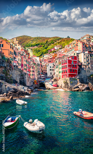Vertical virew of first city of Cique Terre sequence of hill cities - Riomaggiore. Bright morning view of Liguria, Italy, Europe. Splendid seascape of Mediterranean sea. Travel the world.
