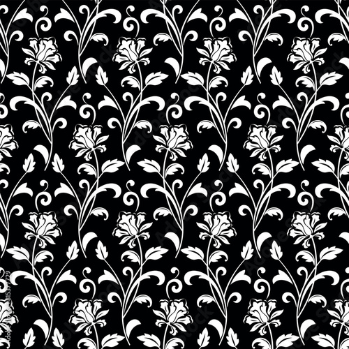 Flower pattern. Seamless white and black ornament. Graphic vector background. Ornament for fabric, wallpaper, packaging.