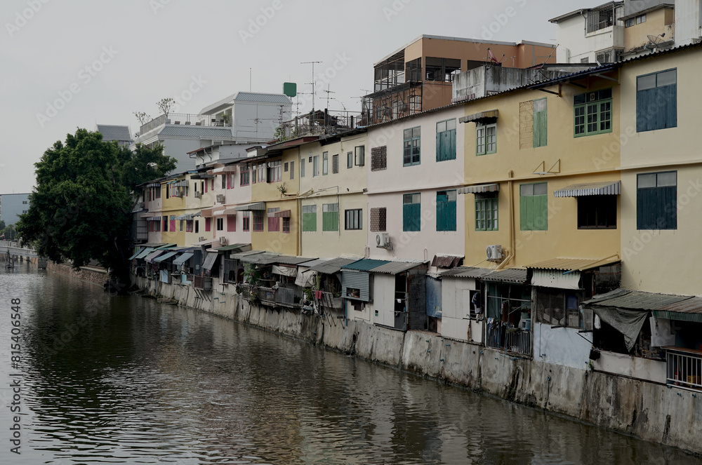 Colorful vintage houses architecture residential buildings by the river in Bangkok, Thailand.
