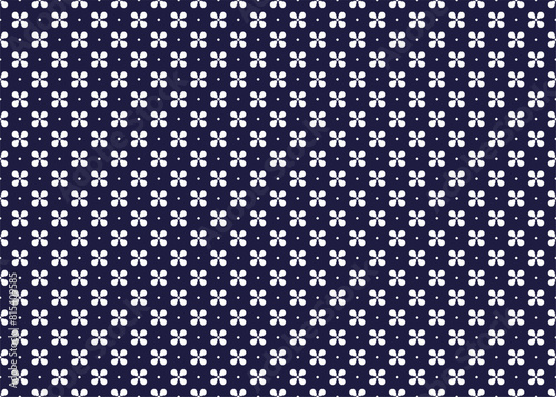 White symbol flowers on dark blue background, ethnic fabric seamless pattern design for cloth, carpet, batik, wallpaper, wrapping etc.
