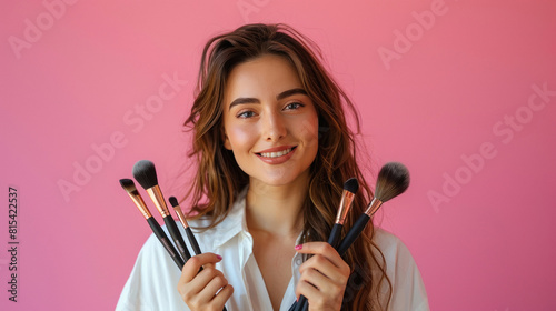 beautiful woman posing for a makeup brush brand