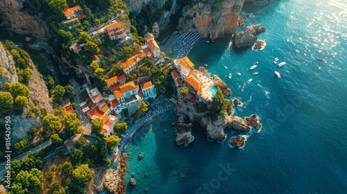 Aerial view of the Amalfi Coast in Italy, with its dramatic cliffs, colorful coastal villages, and the sparkling blue Mediterranean Sea. 