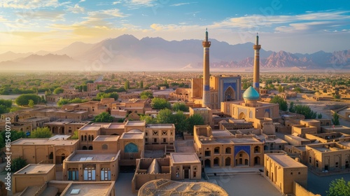 Aerial view of the Yazd city in Iran, featuring the ancient mudbrick architecture and the iconic windcatchers against the backdrop of the surrounding desert.      photo