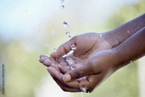 Hands  splash and person with water in nature for bacteria washing  hydration or body hygiene. Wellness  organic and outdoor health in aqua to wash or clean to prevent germs  dirt or dust outside