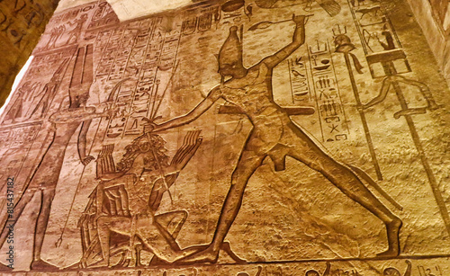 Famous wall bas relief with a scene from the Battle of Kadesh in 1274 BC depicting Ramesses II slaying his enemies in front of Amun re at the Great Temple of  Abu Simbel built by Ramesses II in Egypt