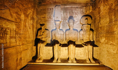 Statues of Ptah,Amun Re,Ramesses II and Re Horakhty inside the sanctum,sun directly shining on Amun and Ramesses during the Equinoxes at the Great Temple of  Abu Simbel built by Ramesses II in Egypt