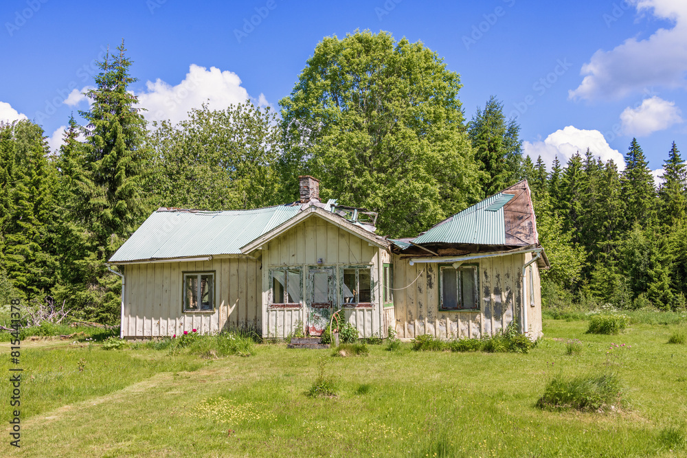 Fototapeta premium Ruined roof on an old house in the countryside