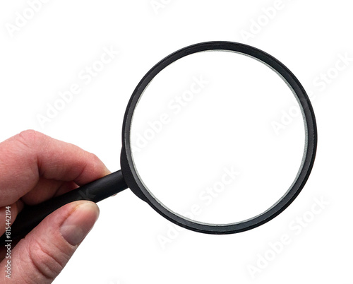 A round magnifying glass in a black frame is held by a human hand. Hand with a magnifying glass on a white background. Blank space for text. For your design.