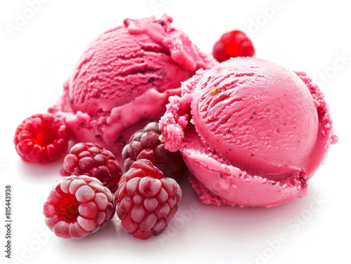A close up of two pink ice cream scoops with raspberries on top