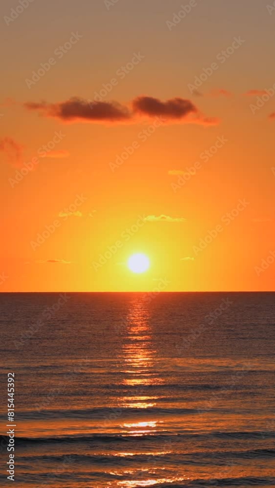 Sun rising above the ocean waves vertical video Sun rising above the ocean waves vertical video