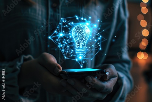 person holding mobile phone with a light bulb logo