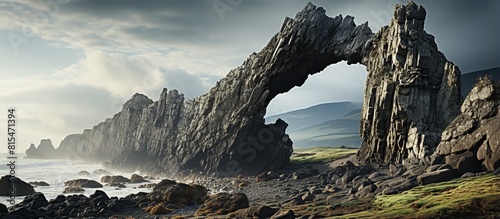 Natural Arch Formation on Coastline, Fantasy alien planet. Mountain and sky.