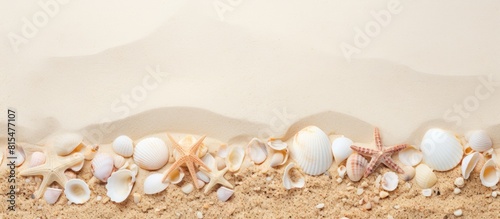 A sandy background adorned with sea shells providing ample room for a copy space image © HN Works