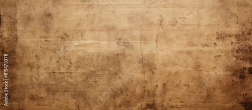 A vintage grunge background with crumpled and dirty paper sheet The old brown texture shows scratches and rough spots It is isolated on a white background and provides copy space for a text box or to