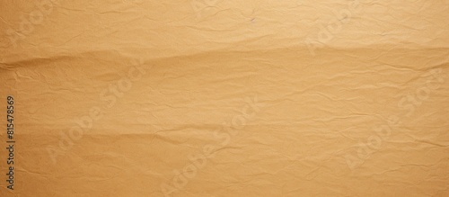 A yellowish brown paper background with a textured cut offering ample space for a copy space image