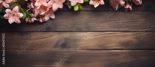 A vintage style wooden background featuring a flower frame and ample copy space for your needs