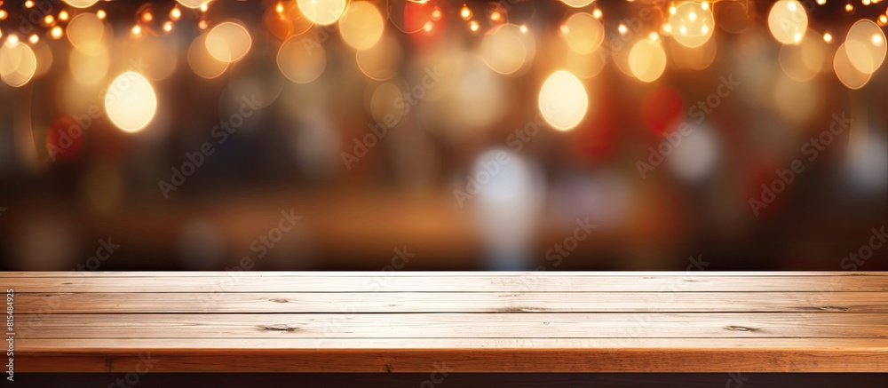 Coffee shop blur background with bokeh and an empty wooden table providing copy space for images