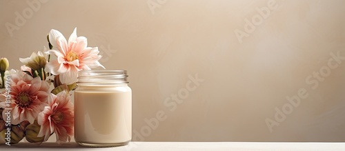 A jar of cream featuring decorative flowers against a mirror background providing ample copy space for additional elements