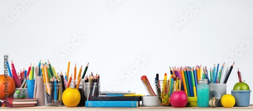 A copy space image featuring various school supplies and tools set against a white background
