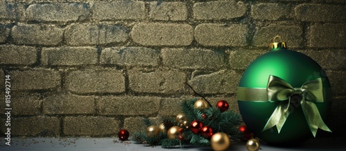 A festive Christmas ornament featuring a green ball adorned with a bow and accompanied by small gifts against a wall backdrop serves as a delightful xmas decoration 133 characters. Creative banner photo